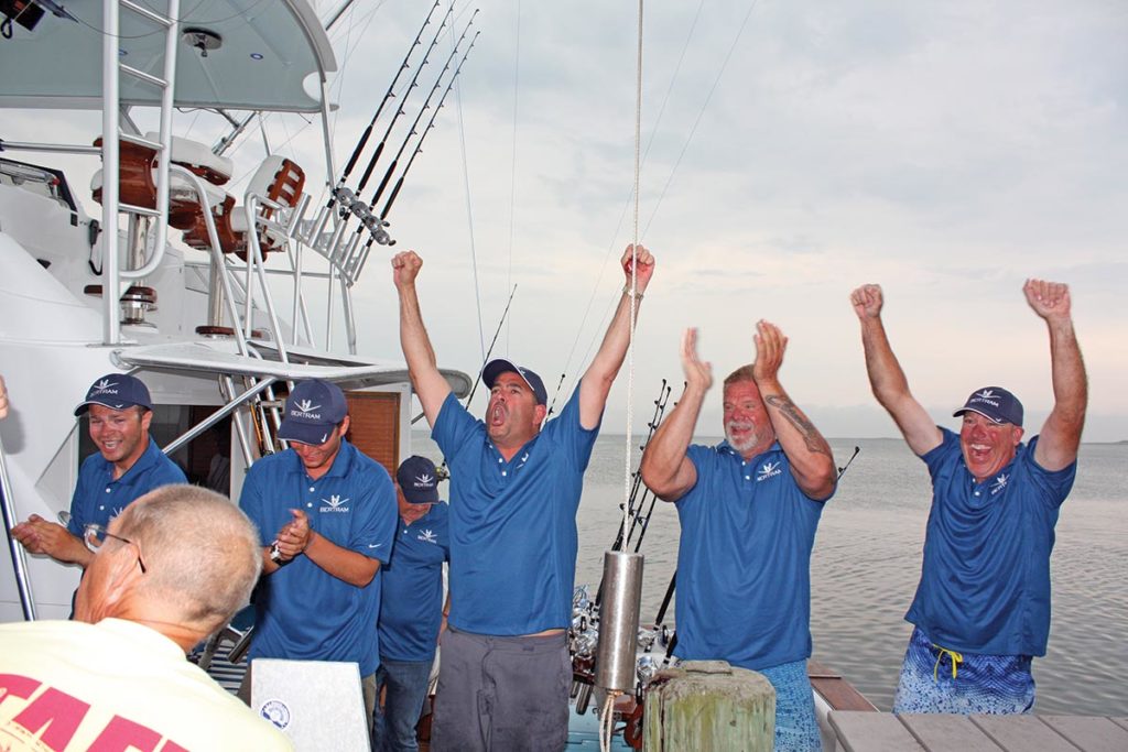 The Melina crew celebrates during the weigh-in of their 356-pound blue marlin at the 49th annual White Marlin Invitational in 2018